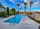 Stunning community pool with palm trees and desert landscaping at 25 Luce Del Sole # 3, Henderson, NV 89011
