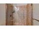 Tiled shower with glass door and shower head in a bathroom at 25 Luce Del Sole # 3, Henderson, NV 89011