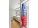 Bathroom featuring a vanity with white cabinets and a Frida Kahlo-themed shower curtain at 2699 Aldonza Dr, Henderson, NV 89014