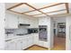 Updated kitchen with white cabinets, stainless steel appliances, and modern backsplash at 2699 Aldonza Dr, Henderson, NV 89014