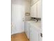 Functional laundry room with a washer, dryer, and storage cabinets at 2699 Aldonza Dr, Henderson, NV 89014