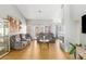 Bright living room with vaulted ceilings, wood floors, and a cozy fireplace at 2699 Aldonza Dr, Henderson, NV 89014