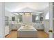 Bright main bathroom featuring a soaking tub, dual vanities, tiled walls, and natural light at 2699 Aldonza Dr, Henderson, NV 89014