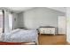 Spacious main bedroom with wood floors, neutral tones, vaulted ceiling and walk in closet at 2699 Aldonza Dr, Henderson, NV 89014
