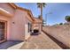 Exterior view of the home's covered patio and desert landscaping at 2699 Aldonza Dr, Henderson, NV 89014