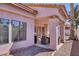Covered patio with an outdoor dining set and gas grill at 2699 Aldonza Dr, Henderson, NV 89014