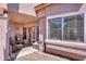 Covered patio with a gas grill and outdoor dining set at 2699 Aldonza Dr, Henderson, NV 89014
