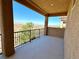 Outdoor balcony offers decorative railing with desert views and partial views of a neighboring property at 2773 Drumlanrig St, Henderson, NV 89044