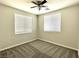 Neutral bedroom featuring a ceiling fan, plush carpet, and window blinds at 2773 Drumlanrig St, Henderson, NV 89044