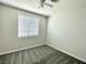 Neutral bedroom featuring plush carpet, a ceiling fan, and a window with horizontal blinds at 2773 Drumlanrig St, Henderson, NV 89044