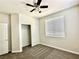 Bright bedroom features a ceiling fan, plush carpet, and a closet at 2773 Drumlanrig St, Henderson, NV 89044