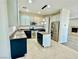 Stylish kitchen with an island, stainless steel appliances, and a view into the living room at 2773 Drumlanrig St, Henderson, NV 89044