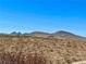 Distant mountain views over desert landscape underneath a clear blue sky at 2773 Drumlanrig St, Henderson, NV 89044