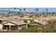 View of neighboring homes with beautiful views of Las Vegas high-rise buildings in the distance at 2773 Drumlanrig St, Henderson, NV 89044