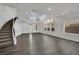 Spacious entryway with modern staircase and large windows, filled with natural light at 3221 Birdwatcher Ave, North Las Vegas, NV 89084
