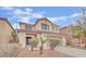 Charming two-story home with a well-manicured lawn and a two-car garage at 3221 Birdwatcher Ave, North Las Vegas, NV 89084