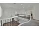 Bright hallway featuring a decorative chandelier and wrought iron banister at 3221 Birdwatcher Ave, North Las Vegas, NV 89084