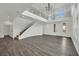 Expansive living area showcases a wrought iron staircase, chandelier, and grand entryway at 3221 Birdwatcher Ave, North Las Vegas, NV 89084