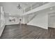 Large living area featuring a modern staircase and chandelier, offering ample space and light at 3221 Birdwatcher Ave, North Las Vegas, NV 89084