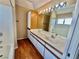 Bathroom featuring a double sink vanity, bathtub, and a vanity mirror at 3550 Bay Sands Dr # 2097, Laughlin, NV 89029