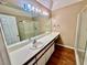 Bathroom vanity with a large mirror, ample lighting, and wooden flooring at 3550 Bay Sands Dr # 2097, Laughlin, NV 89029