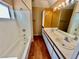Bathroom featuring a double sink vanity, bathtub, and wood flooring at 3550 Bay Sands Dr # 2097, Laughlin, NV 89029