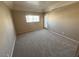 Neutral bedroom featuring carpet, natural light, and a glass door to the exterior at 3550 Bay Sands Dr # 2097, Laughlin, NV 89029