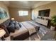 This bedroom features an ensuite bath, a large window, and a large TV at 3550 Bay Sands Dr # 2097, Laughlin, NV 89029