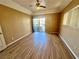 Bedroom featuring wood-look flooring, ceiling fan, and sliding doors to balcony at 3550 Bay Sands Dr # 2097, Laughlin, NV 89029