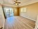Bedroom with wood-style floors, ceiling fan, and access to a private balcony at 3550 Bay Sands Dr # 2097, Laughlin, NV 89029