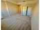 Neutral bedroom featuring beige carpet and a closet with sliding doors at 3550 Bay Sands Dr # 2097, Laughlin, NV 89029