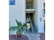 Exterior view of unit 14 featuring stairwell and desert landscaping at 3550 Bay Sands Dr # 2097, Laughlin, NV 89029