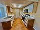 Compact kitchen features modern appliances, white cabinetry, and wood look flooring at 3550 Bay Sands Dr # 2097, Laughlin, NV 89029