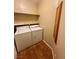 Functional laundry area with washer, dryer, and a built-in cabinet for storage at 3550 Bay Sands Dr # 2097, Laughlin, NV 89029