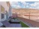 The backyard has pavers, rocks, and artificial grass, perfect for relaxing outdoors at 378 Rosefinch St, Henderson, NV 89012