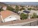 This backyard features a retaining wall, gravel and a view of the city at 378 Rosefinch St, Henderson, NV 89012