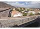 This backyard features a retaining wall, gravel and a view of the city at 378 Rosefinch St, Henderson, NV 89012