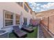 The backyard has pavers, rocks, and artificial grass, perfect for relaxing outdoors at 378 Rosefinch St, Henderson, NV 89012