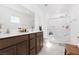 This bathroom features dual sinks, a toilet and a glass shower door at 378 Rosefinch St, Henderson, NV 89012
