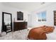 The bedroom features a large dresser, big mirror and natural light at 378 Rosefinch St, Henderson, NV 89012