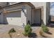 Inviting home with a two-car garage and stone-paved driveway and front entrance at 378 Rosefinch St, Henderson, NV 89012