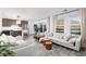 Spacious living room featuring modern furnishings, neutral decor, and large windows at 378 Rosefinch St, Henderson, NV 89012