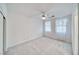 Bright bedroom featuring soft carpet, a ceiling fan, and windows with lace curtains at 3891 Sedgwick, Pahrump, NV 89061