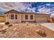 Beautiful single-story house with a two-car garage, rock landscaping, and an inviting beige color scheme at 3891 Sedgwick, Pahrump, NV 89061
