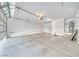 Spacious garage with an automatic door opener, water heater, and plenty of shelving for storage at 3891 Sedgwick, Pahrump, NV 89061