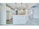 Bright kitchen view showcases white cabinets, breakfast bar and pendant lighting at 3891 Sedgwick, Pahrump, NV 89061