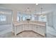 Bright kitchen shows sink, white cabinets, countertop and seamless flow to living spaces at 3891 Sedgwick, Pahrump, NV 89061
