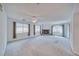 Expansive living room with soft carpet, fireplace, and plentiful natural light at 3891 Sedgwick, Pahrump, NV 89061