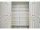 Pantry with white double doors and organized wire shelving from top to bottom at 3891 Sedgwick, Pahrump, NV 89061