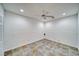 Empty room showcases tiled flooring and ceiling fan offering versatile space at 3891 Sedgwick, Pahrump, NV 89061